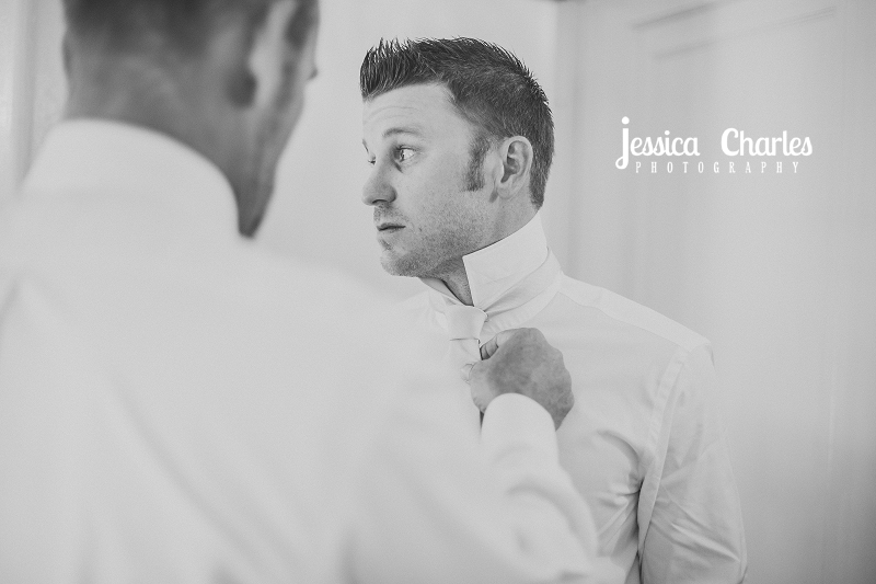 Groom getting ready for the ceremony at powel crosley estate