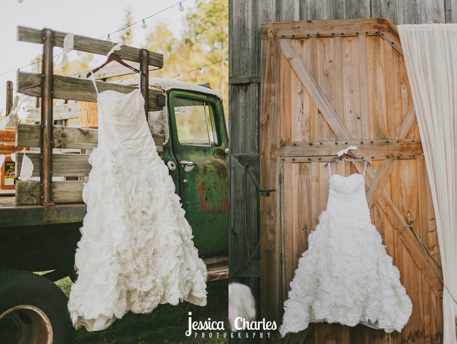 ruffled wedding dress hanging on vintage truck